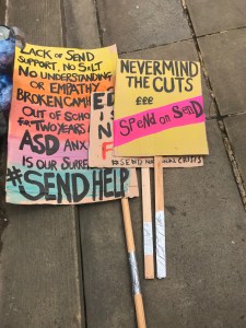 Placards from the SEND march